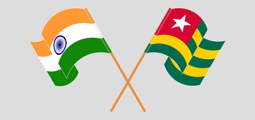 Crossed and waving flags of India and Togo