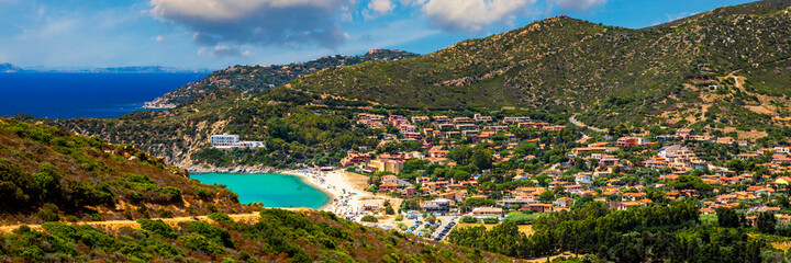 Fototapeta na wymiar The beautiful turquoise water and white sand of Piscadeddus Beach, near Villasimius, Sardinia. The beautiful turquoise water and white sand of Piscadeddus Beach, near Villasimius, Sardinia.