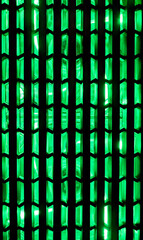 computer grille with green coolers.Green light in PC case fan grill.