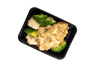 Lunch box with broccoli, cauliflower and chops. Food delivery. Top view. Isolated.
