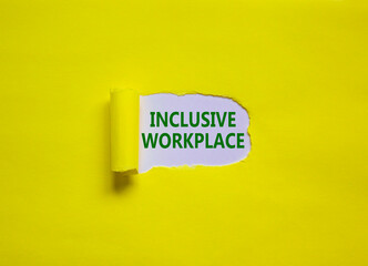 Inclusive workplace symbol. Concept words 'inclusive workplace' appearing behind torn yellow paper....
