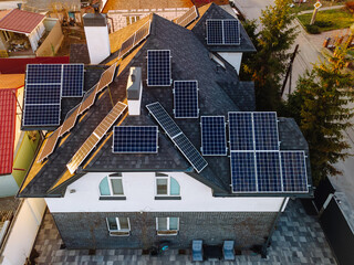 Aerial view of solar photovoltaic panels on a house roof
