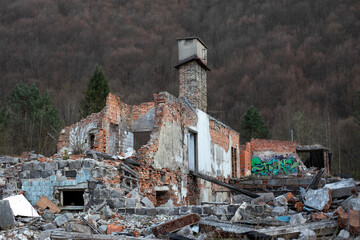 Ruins of the destroyed building in the mountains.