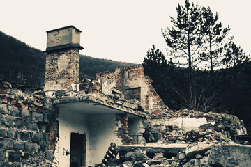 Ruins of the destroyed building in the mountains.