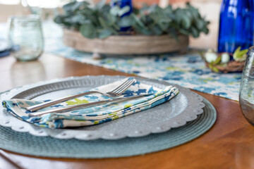 Stylish spring table place setting in blue and green
