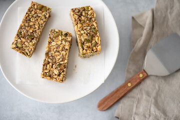 Home made gluten free granola bars served on a white plate.