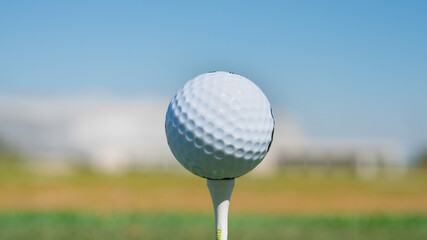 Close up of golf ball on tee.