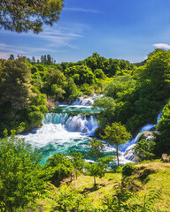 Waterfalls Krka, National Park, Dalmatia, Croatia. View of Krka National Park, Roski Slap location, Croatia, Europe. Beautiful world of Mediterranean countries. Traveling concept background.