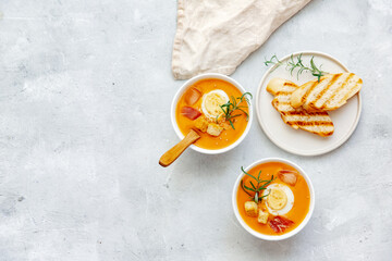 Vegan healthy food. Tomato soup or gazpacho on light  background. Copy space.