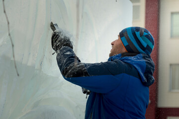 Portrait of a sculptor with a chisel in his hands