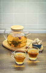 Blooming flowering tea in glass teapot