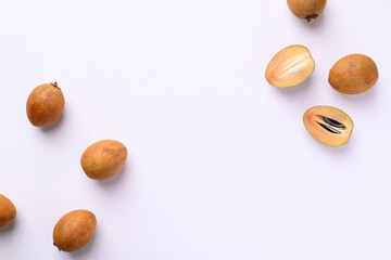 Sapodilla fruit (Manilkara zapota) and other names such as sapota, chikoo, chico, naseberry, or nispero. Sapodilla is tropical fruit evergreen tree and sweet taste fruit