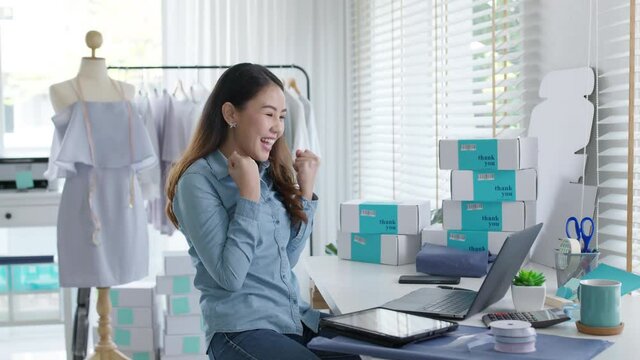 Young attractive beautiful female entrepreneur fund borrower crazy joyful ecstatic face gesture hand yes feeling amazed in peer to peer P2P lending finance or crowdfunding network microfinance approve