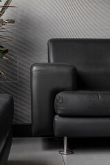 details of the modern leather armchair, furniture in the home interior, style and glamor in the...