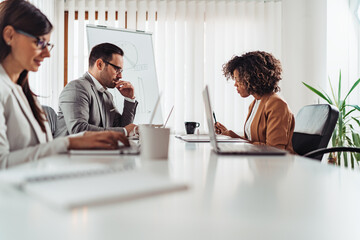 Elegant business people contemplating on the meeting