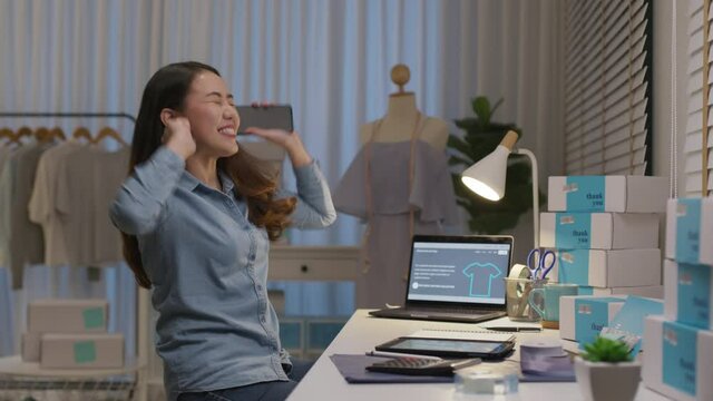 Young attractive beautiful female entrepreneur fund borrower crazy joyful ecstatic face gesture hand yes feeling amazed in peer to peer P2P lending finance or crowdfunding network microfinance approve