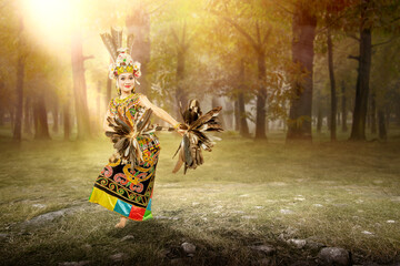 Asian woman dancing East Kalimantan traditional dance (Giring-Giring dance)