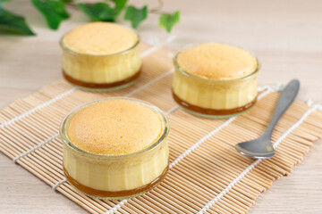 Caramel custard pudding cake in glass bowl
