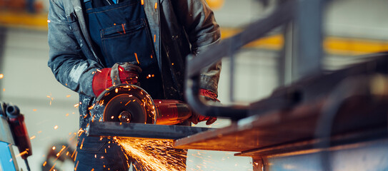 Man working with electric grinder tool