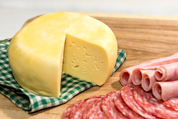 Colonial breakfast served with bread, cheese, ham and salami.