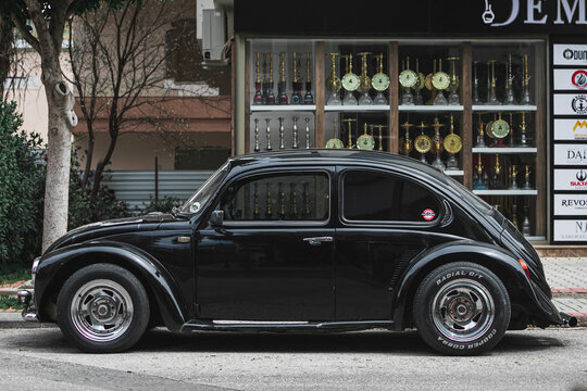 Alanya, Turkey &ndash; April 12 2021:    Vintage black car Volkswagen Beetle, side  view. Photography of a classic car on a street in Turkey