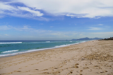 Reserva Beach, in Rio de Janeiro. Sunny day with some clouds. Empty beach.