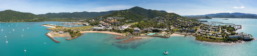 Aerial panoramic afternoon view of beautiful Airlie Beach in Queensland Australia, a popular tourist destination.