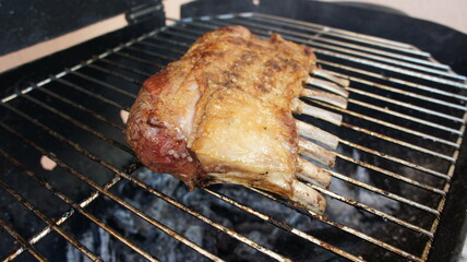 Carré de Cordeiro. Lamb rib roasting on the grill