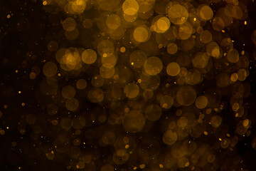 Abstract gold bokeh with black background