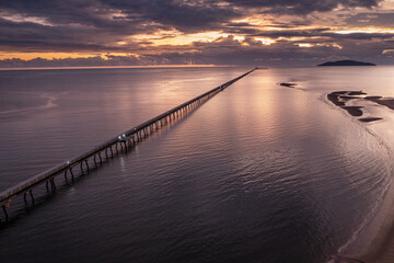Sunrise view of the famous 6km long sugar cane jetty at Lucinda in Far North Queensland, Australia