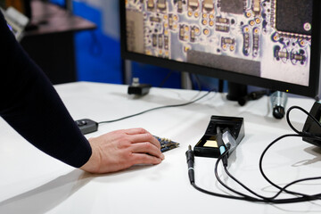 engineer using a digital microscope for inspection