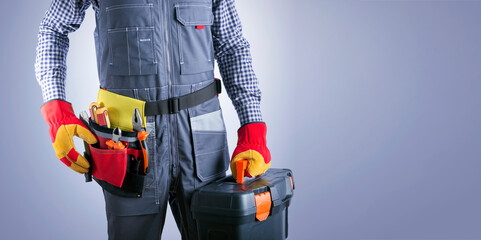 Electrician With Electric Tools Against Light Gray Background With Place For Text. Handyman Work...