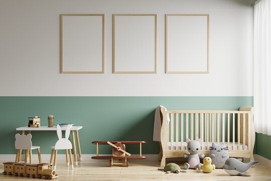 Picture frame on the wall in a children's room with a newborn bed. Decorated with toys with dolls on the floor.3d rendering.