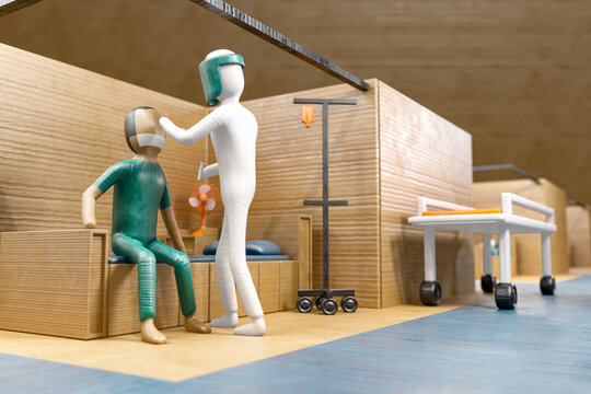 3d rendering cardboard paper art style concept of a doctor in protective suit taking a nasal swap from a patient to test for possible covid-19 in an emergency field hospital background.