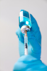 syringe with drop of water