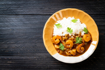Shrimps in curry sauce on rice