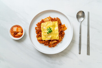 kimchi fried rice with pork and topped cheese