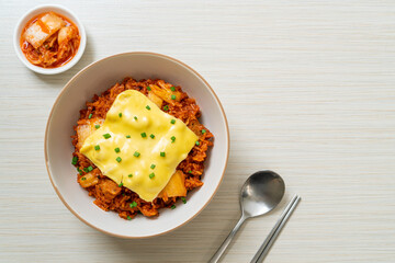 kimchi fried rice with pork and topped cheese