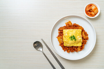 kimchi fried rice with pork and topped cheese