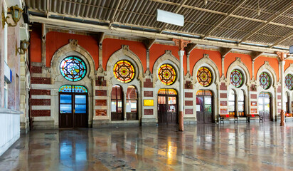 View of historic building of Sirkeci railway Terminal in Ottoman architectural style and empty...