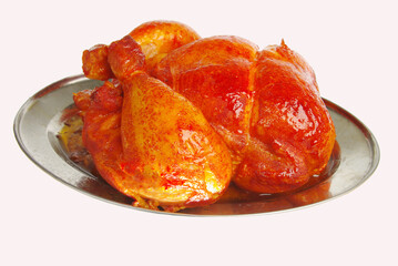 Grilled chicken in a frying pan .Isolated on a white background. 