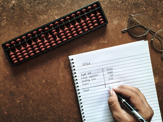 Vintage calculator and pen on notebook