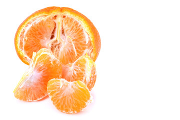 Half a tangerine and slices isolated on a white background.