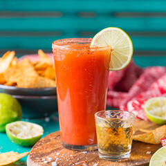 Mexican alcohol cocktail Chavela served with tequila shot