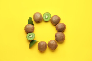 Frame made of tasty kiwi on color background