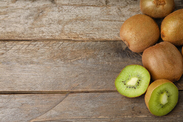 Tasty ripe kiwi on wooden background