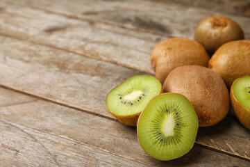 Tasty ripe kiwi on wooden background