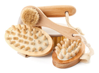 Different massage brushes on white background