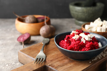 Plate with tasty beet risotto on grey background