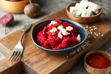 Plate with tasty beet risotto on grey background